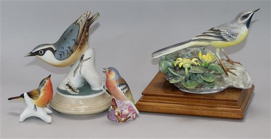 A Royal Worcester model of a grey wagtail, and three other bird figures